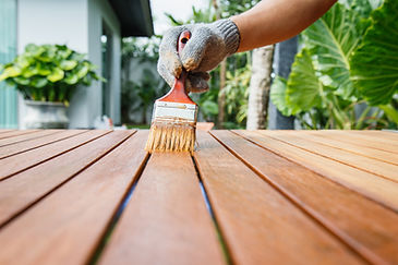 wood deck maintenance by applying wood finish as a protective layer